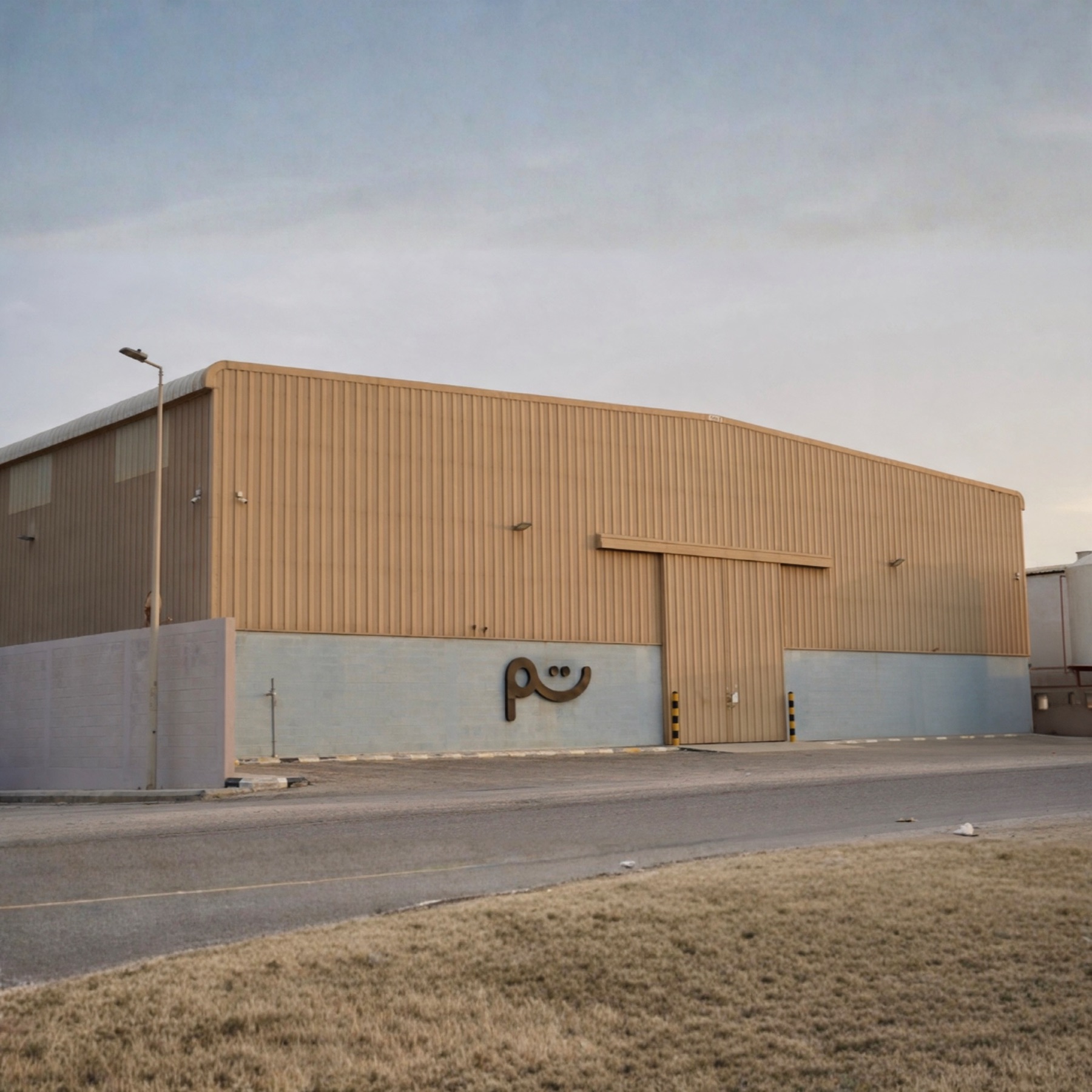 Tamm’s warehouse from outside, with the Tamm mark on its front